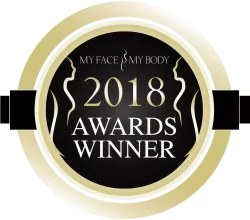 Award badge for "My Face My Body" 2018, featuring a gold circular design with elegant silhouettes. The badge highlights recognition in the beauty and aesthetics industry, emphasizing excellence and achievement. Ideal for showcasing awards in marketing materials or on websites to enhance credibility and attract potential clients.
