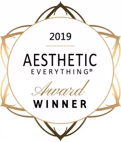 Award badge for Aesthetic Everything 2019, featuring a circular design with gold accents and text stating "2019 Aesthetic Everything Award Winner."