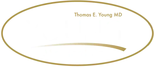 Logo of Young Medical Spa, featuring the name prominently in white text against a black background, with "Thomas E. Young MD" displayed above in smaller text. The design includes a gold oval border, emphasizing the spa's focus on beauty and wellness. This image represents a professional medical spa dedicated to providing aesthetic treatments and services. Ideal for enhancing online visibility and brand recognition in search engines while ensuring accessibility for all users.